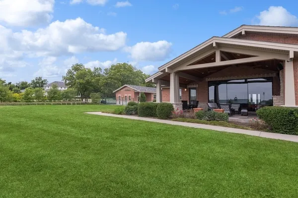 a outdoor space with patio the couches and pool table with chairs and garden view