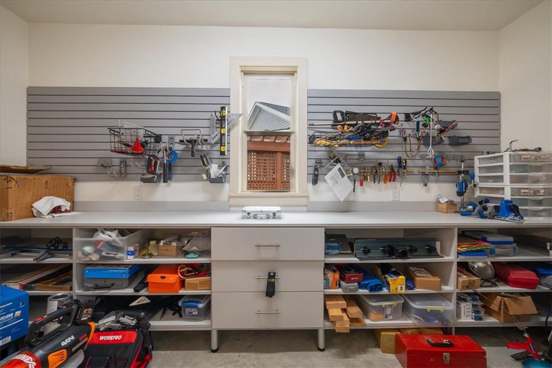 217 Pershing Avenue Clemson, SC 29631 - Photo 28 of 37 A workbench offers abundant storage, enhancing organization within this well-appointed workshop space.