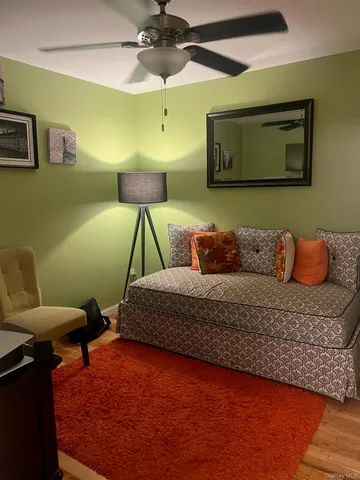 a bedroom with a bed and a lamp