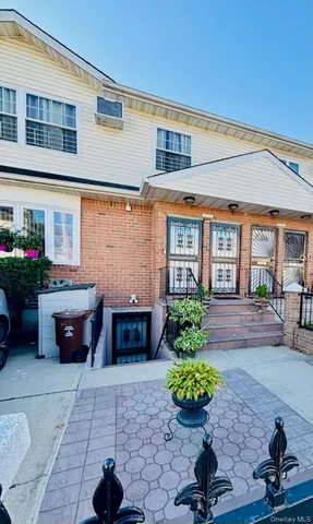 a view of a chairs and table in the backyard