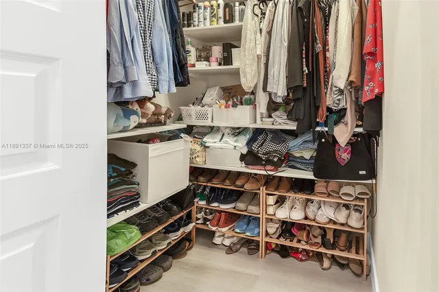 a living room with furniture a chandelier and entryway