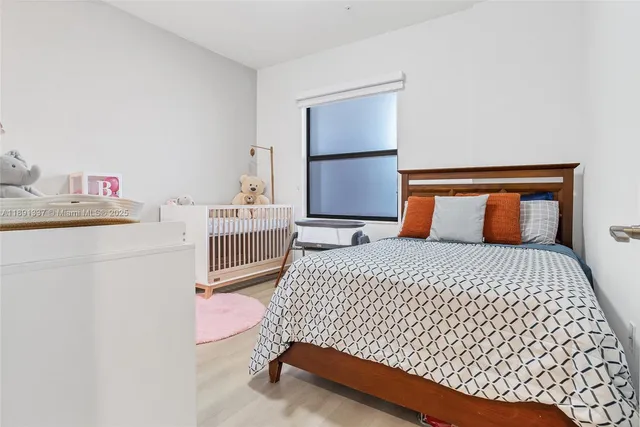 a view of a house with backyard and wooden fence