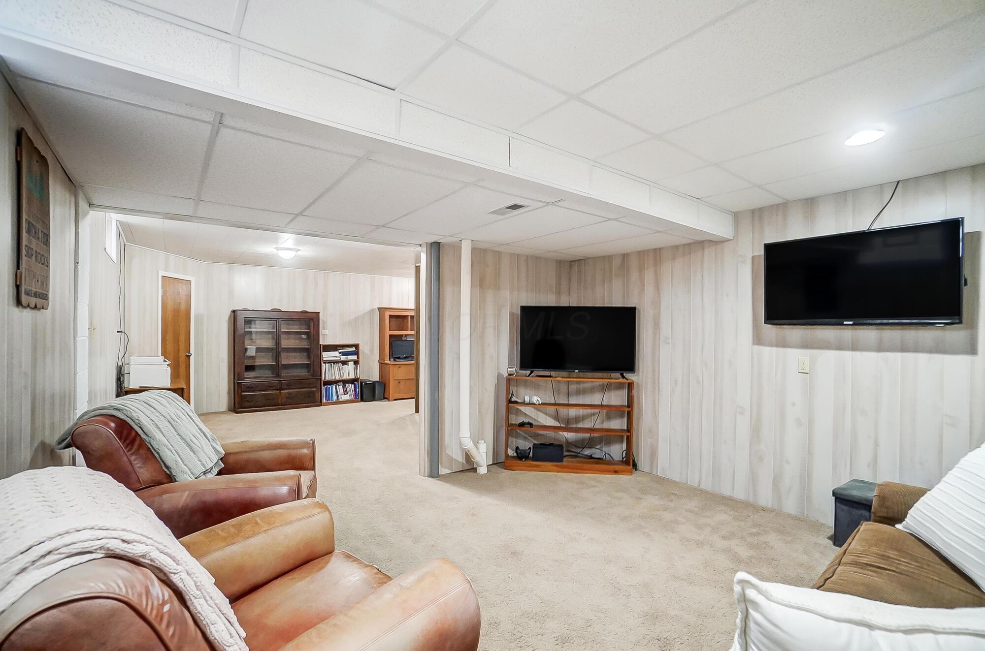 5337 Sutter Home Road Hilliard, OH 43026 - Photo 53 of 72 Finished area in the basement adds extra space for a home office and entertainment room!