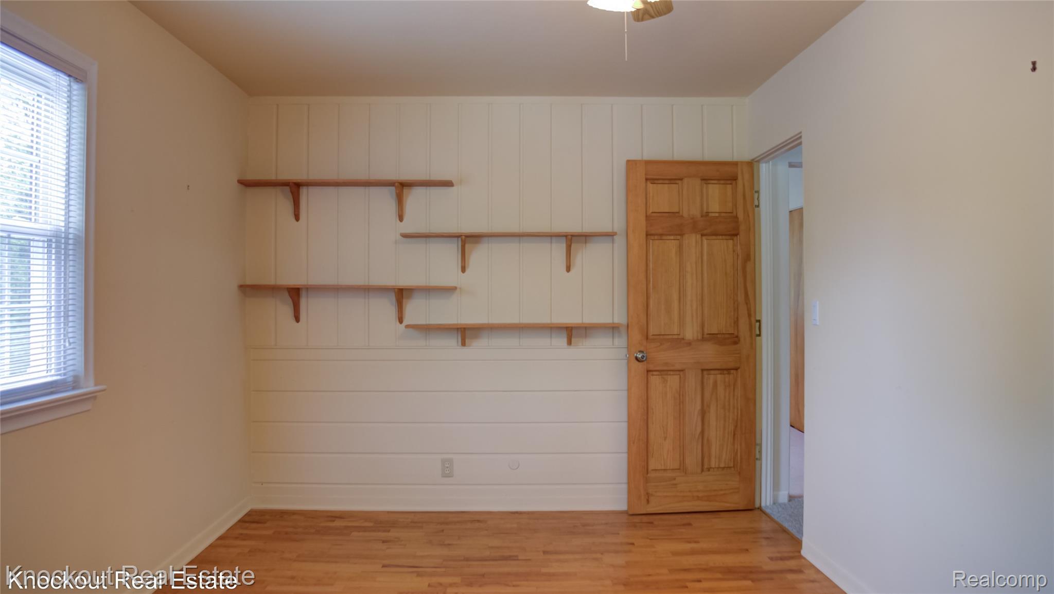 4465 Dirker Road Saginaw, MI 48638 - Photo 28 of 56 Unfurnished room featuring light wood-type flooring and ceiling fan
