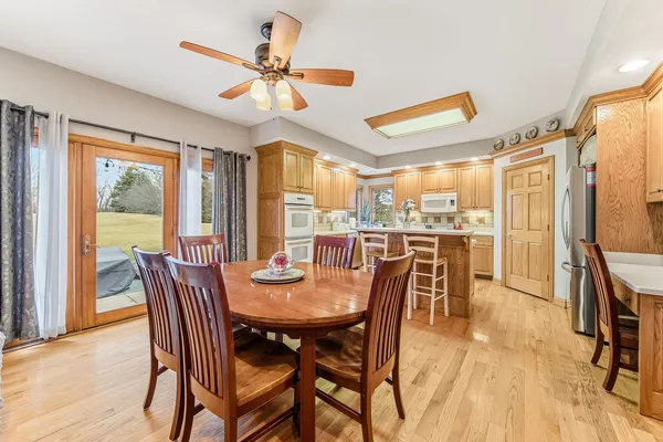 a view of a dining room with furniture and a chandelier