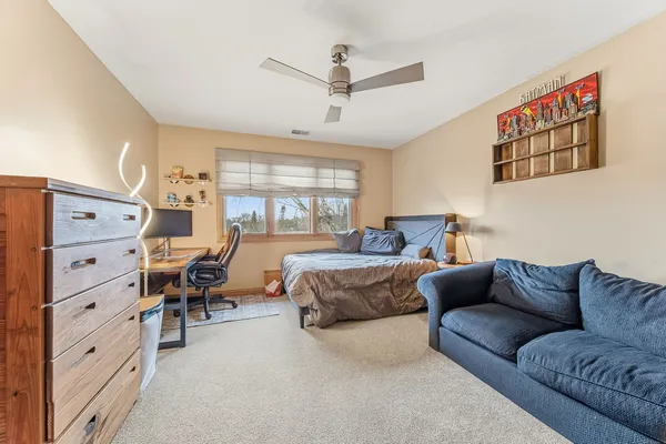 a bedroom with furniture and a window