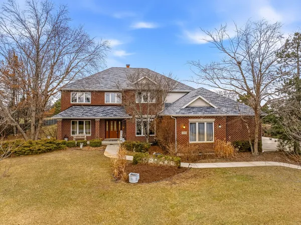 a front view of a house with a yard patio and fire pit