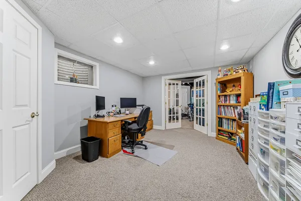a view of work space with furniture and staircase