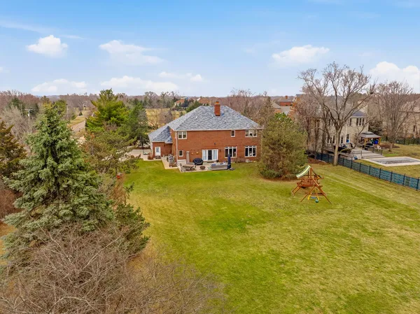 a view of a swimming pool with an outdoor space and seating area