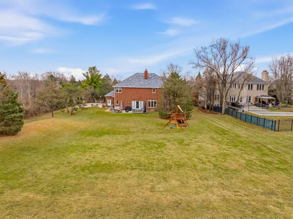 a swimming pool with trees in front of it