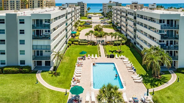 a view of a lake with houses in the back