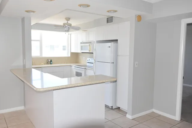 a kitchen with a refrigerator a sink and dishwasher