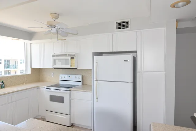 a view of a room that has a bed and a window
