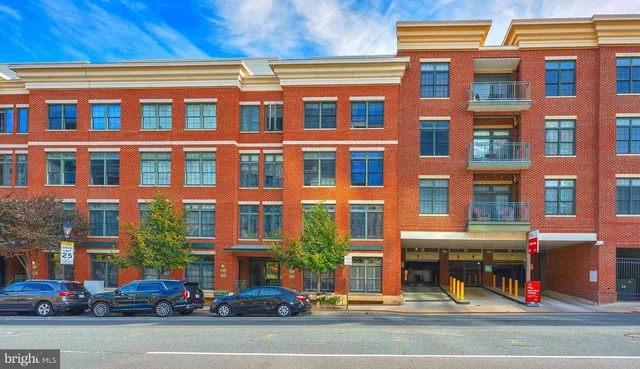 a view of a building and a people on a street
