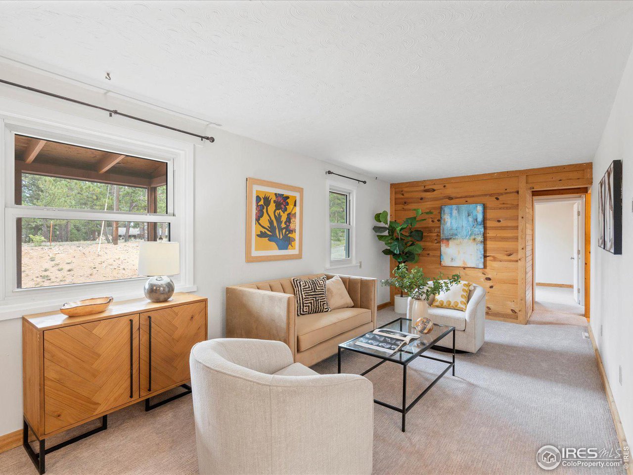 31851 Warrens Road Golden, CO 80403 - Photo 11 of 40 a living room with furniture and a large window