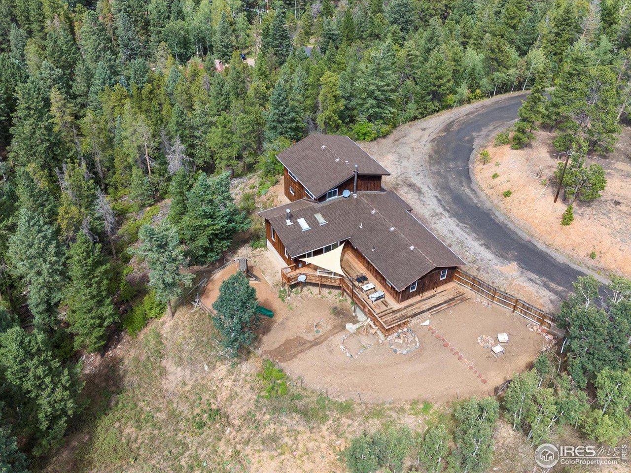 31851 Warrens Road Golden, CO 80403 - Photo 33 of 40 an aerial view of a house with a garden