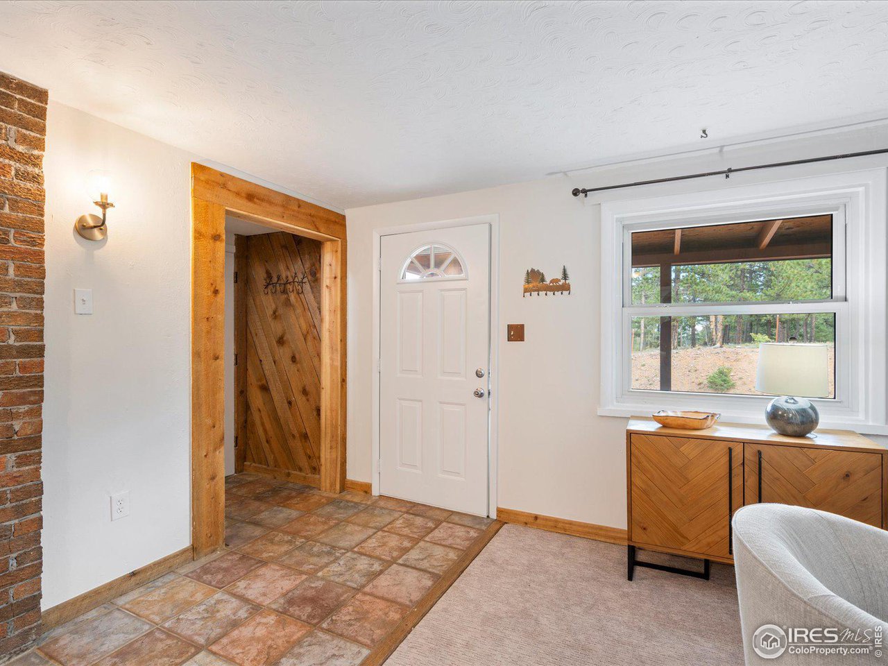 31851 Warrens Road Golden, CO 80403 - Photo 8 of 40 a room with furniture and window