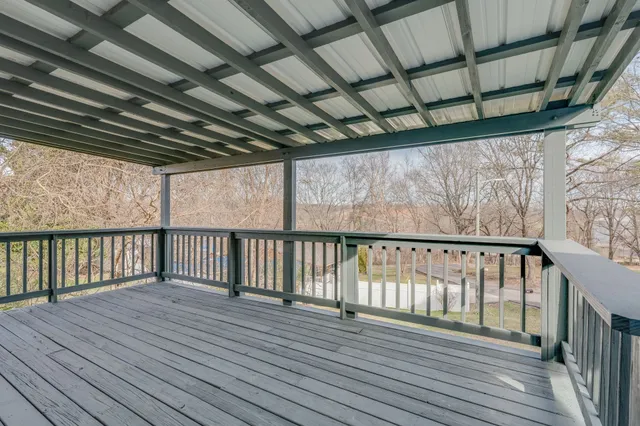 a view of balcony with wooden floor
