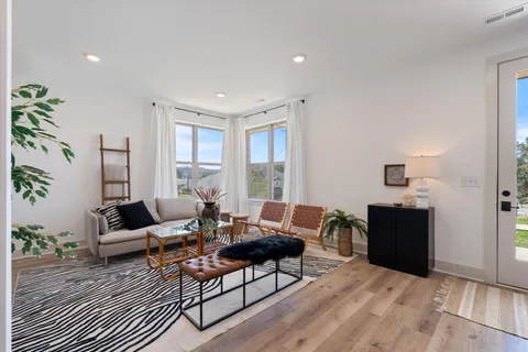 a living room with furniture and a window