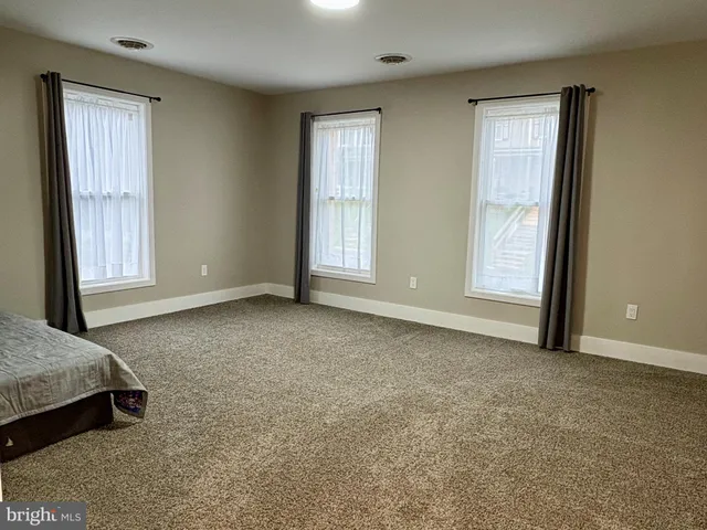 an empty room with windows