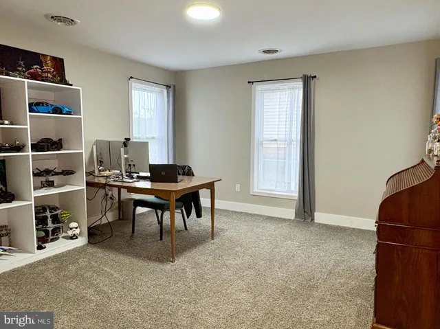 a workspace with furniture and window