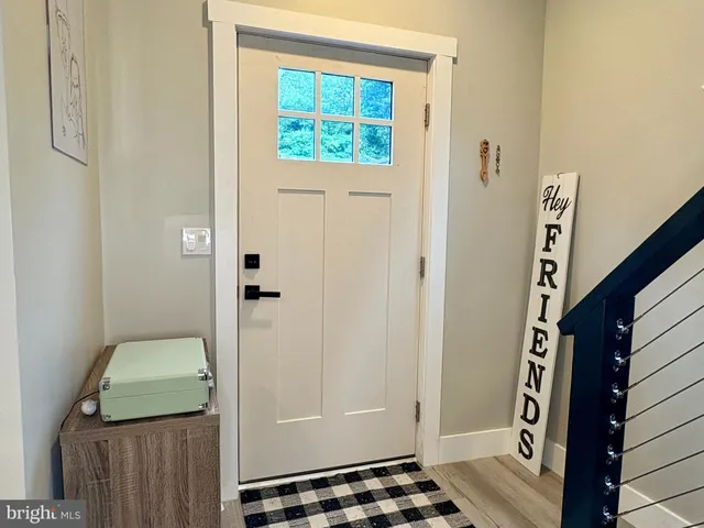 a bathroom with a granite countertop shower and a sink