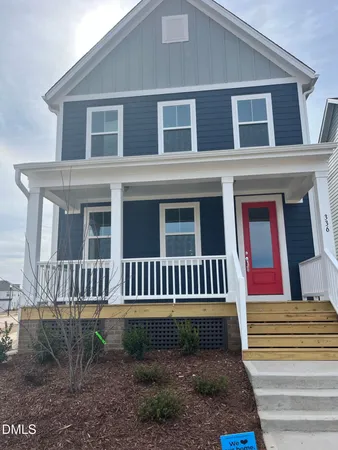 a front view of a house with a porch