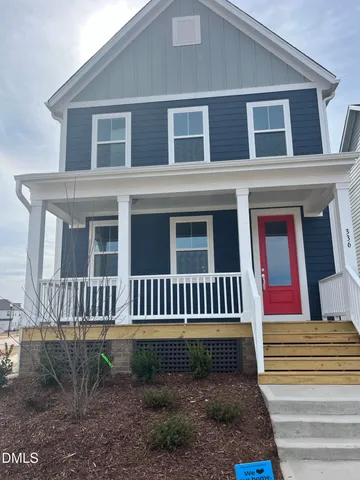 a front view of a house with a porch