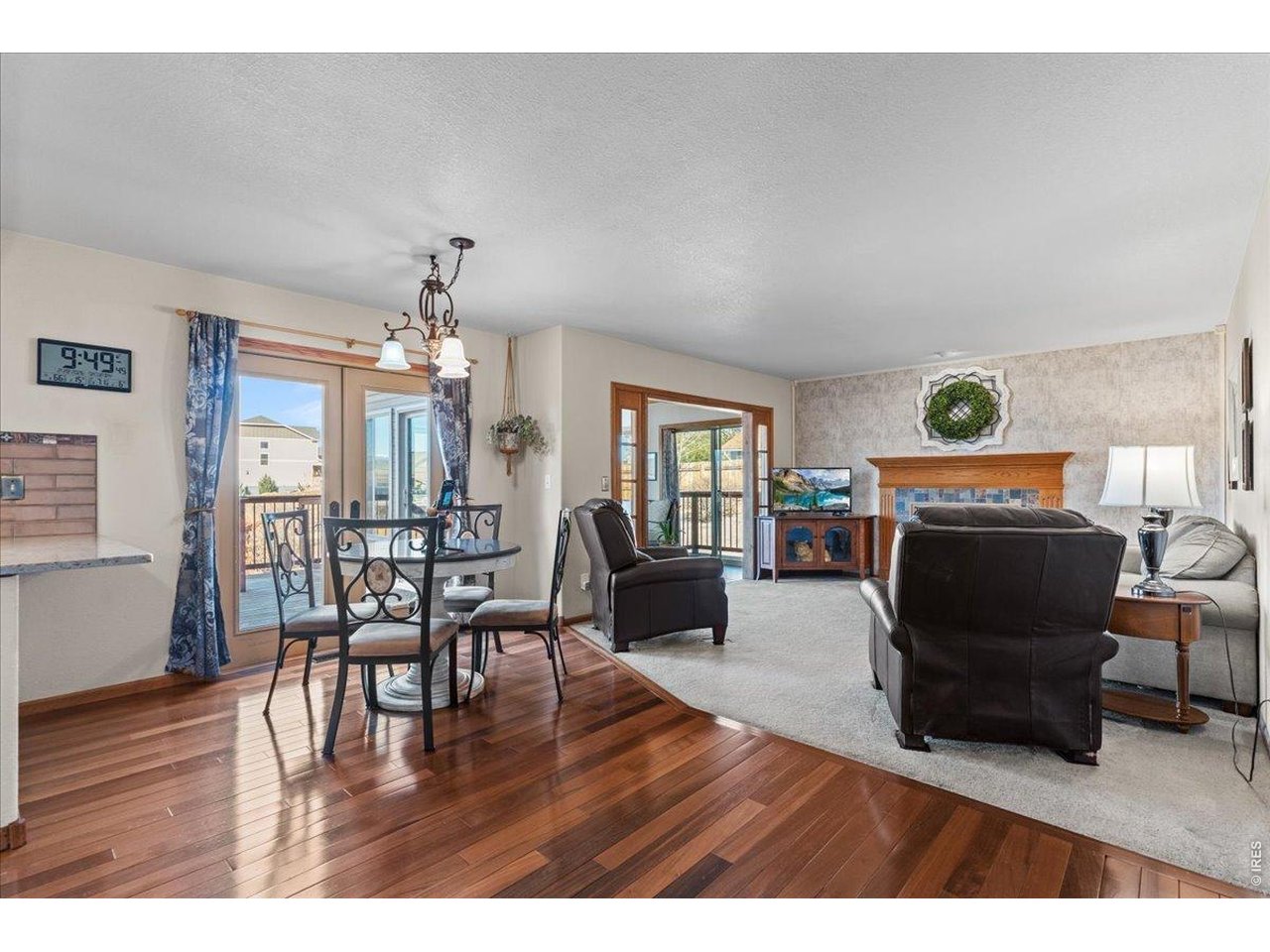 537 South 9th Street Berthoud, CO 80513 - Photo 15 of 47 a living room with furniture and a wooden floor