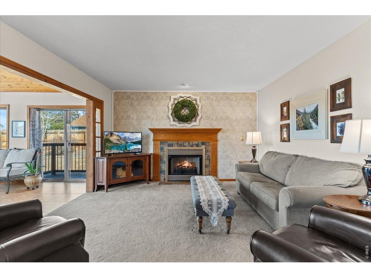 537 South 9th Street Berthoud, CO 80513 - Photo 16 of 47 a living room with furniture and a fireplace
