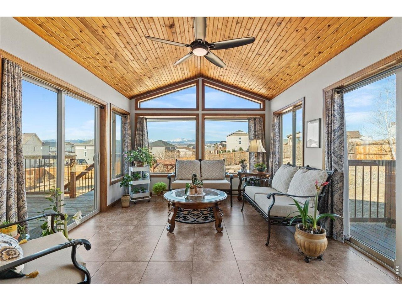 537 South 9th Street Berthoud, CO 80513 - Photo 18 of 47 a living room with furniture and floor to ceiling windows