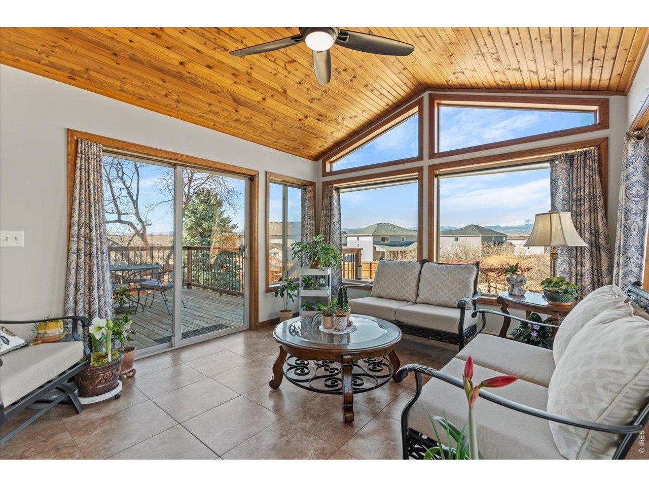 537 South 9th Street Berthoud, CO 80513 - Photo 20 of 47 a living room with furniture and a floor to ceiling window