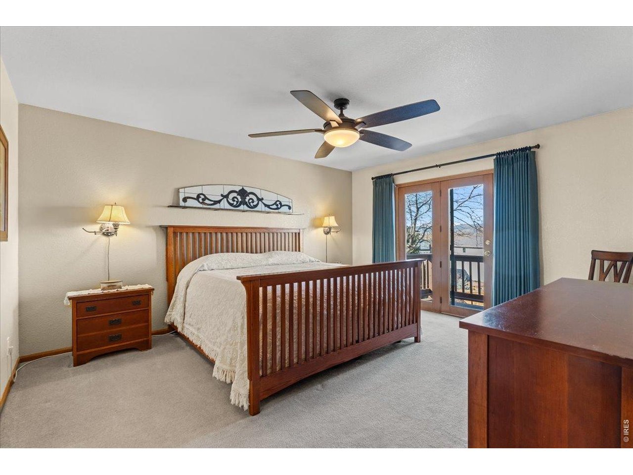 537 South 9th Street Berthoud, CO 80513 - Photo 22 of 47 a bedroom with a bed and a chandelier
