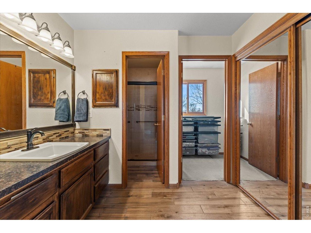 537 South 9th Street Berthoud, CO 80513 - Photo 25 of 47 a bathroom with a sink and a mirror