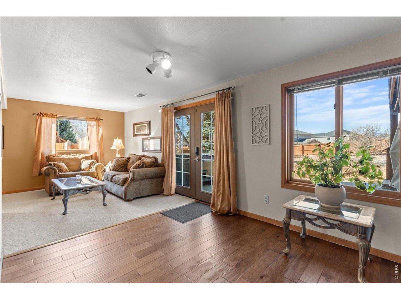 537 South 9th Street Berthoud, CO 80513 - Photo 35 of 47 a living room with furniture and a wooden floor