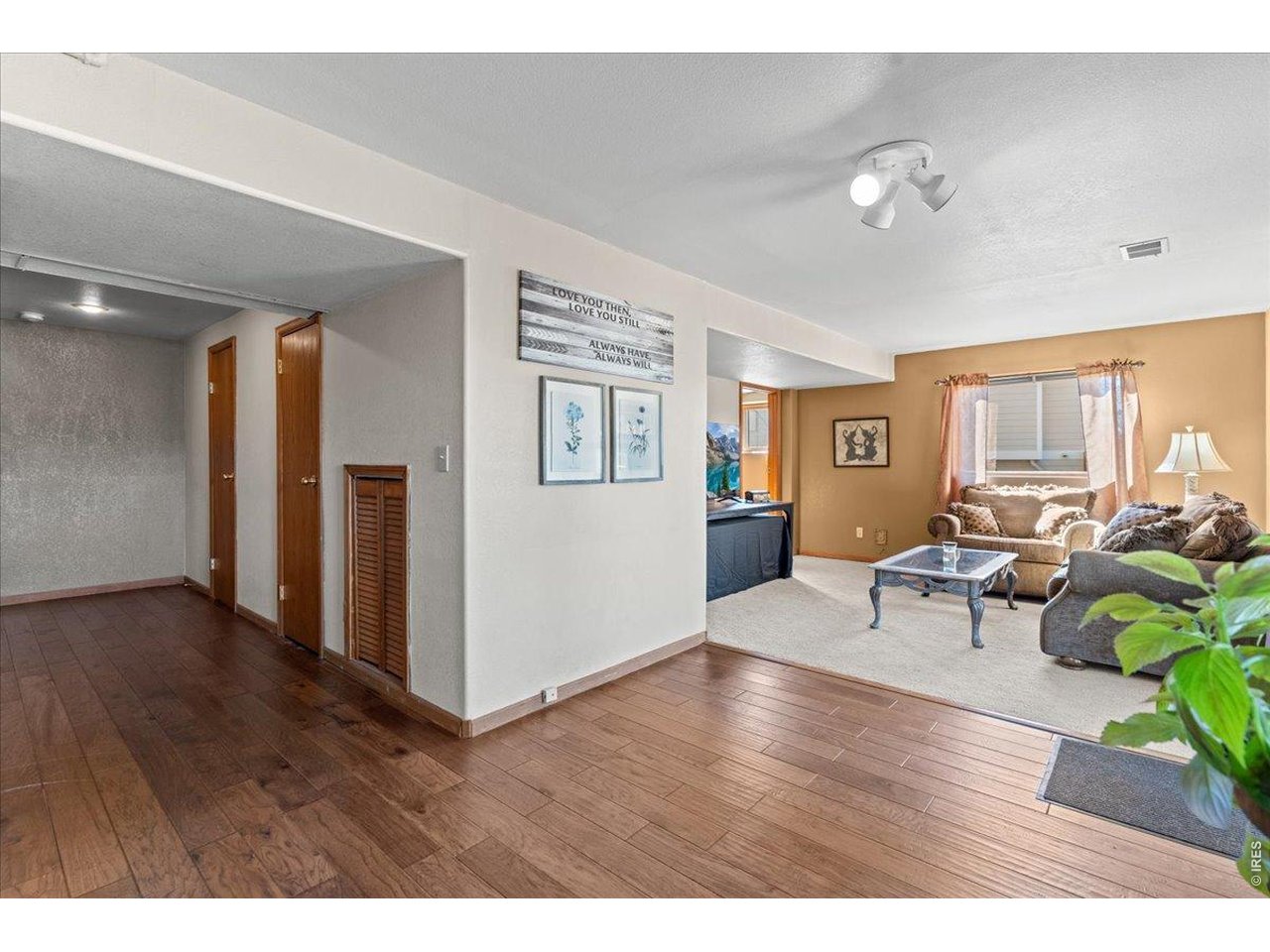 537 South 9th Street Berthoud, CO 80513 - Photo 37 of 47 a living room with furniture and a wooden floor