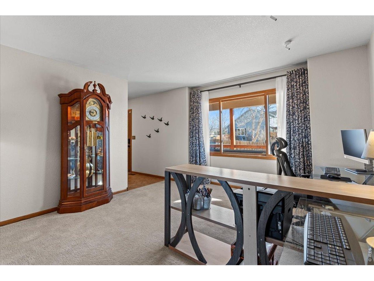 537 South 9th Street Berthoud, CO 80513 - Photo 7 of 47 a view of a livingroom with furniture and window