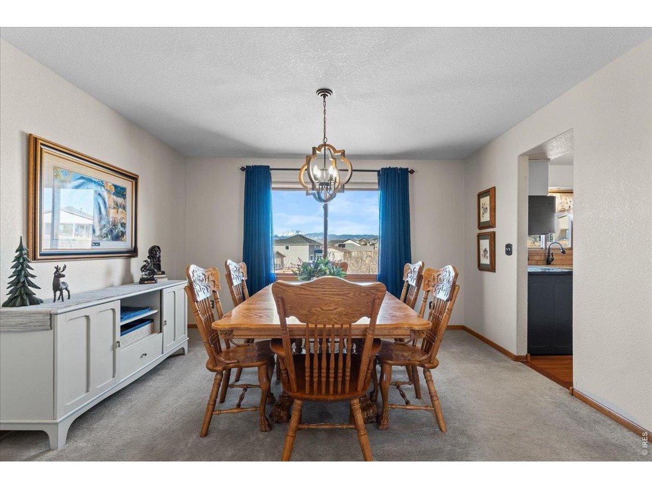 537 South 9th Street Berthoud, CO 80513 - Photo 10 of 47 a view of a dining room with furniture window and wooden floor
