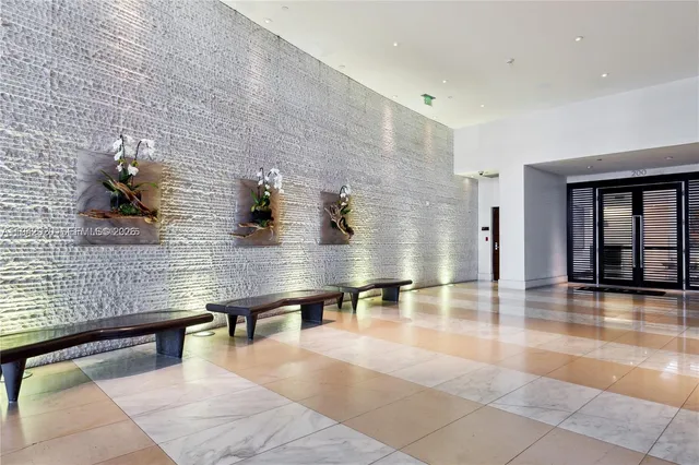 a lobby with furniture and window