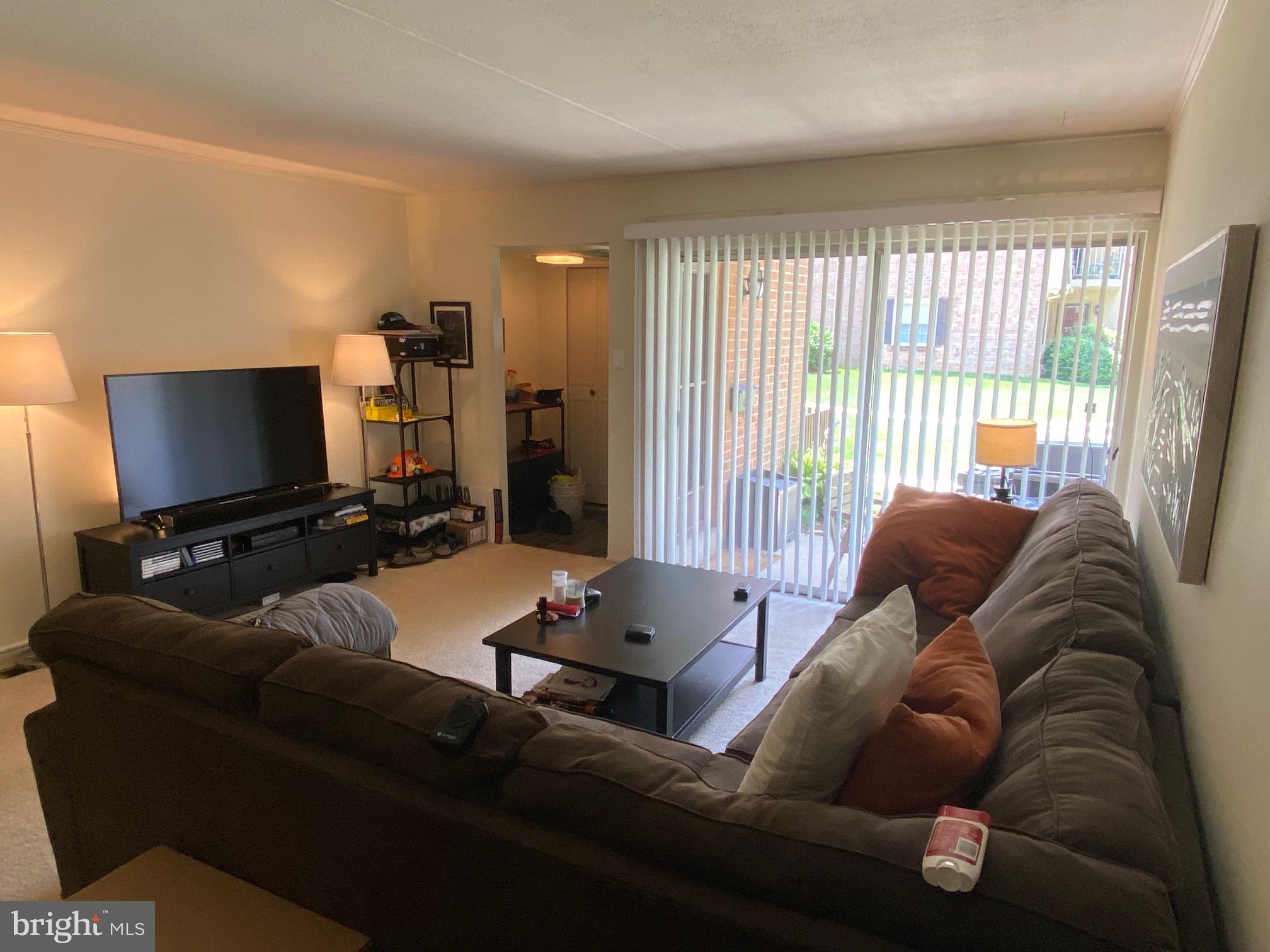 16 Old Forge Crossing, Unit 16 Devon, PA 19333 - Photo 6 of 12 a living room with furniture and a flat screen tv