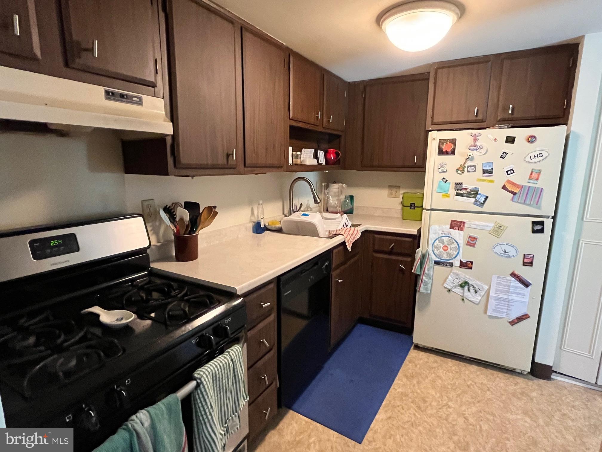 16 Old Forge Crossing, Unit 16 Devon, PA 19333 - Photo 10 of 12 a kitchen with a stove a refrigerator and a sink