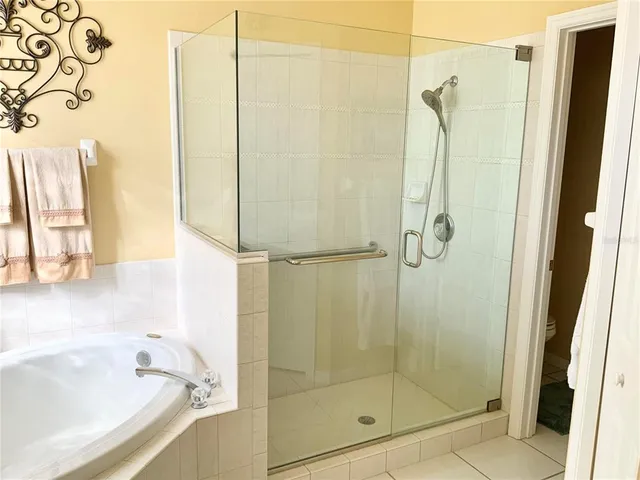 a bathroom with a bathtub and shower