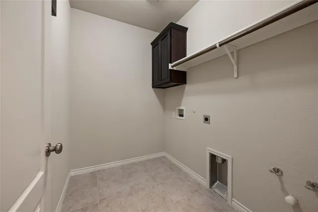 a kitchen with granite countertop a sink a counter space appliances and cabinets