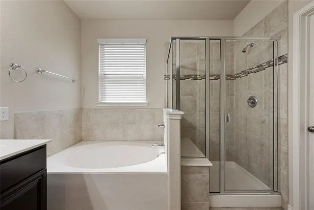 a view of a livingroom with a ceiling fan and window
