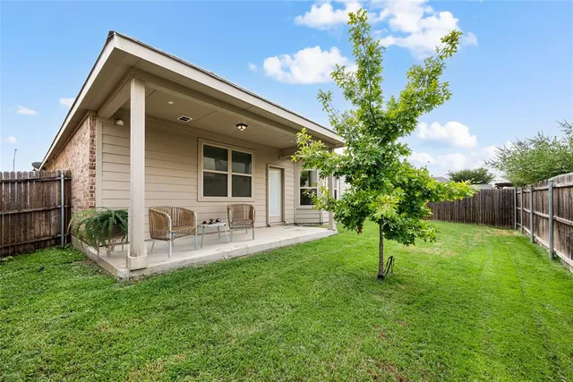 an empty room with windows and bathroom