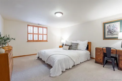 a bedroom with bed and a window