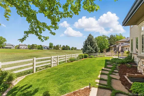 a view of a garden with houses