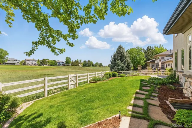 a view of a garden with houses