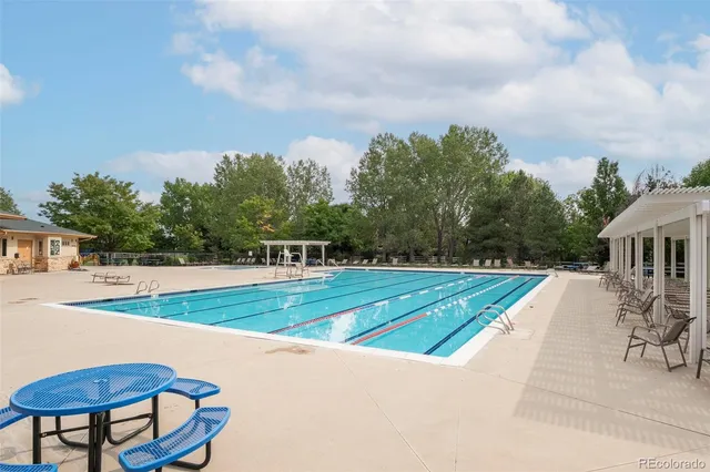 an aerial view of a house with a swimming pool