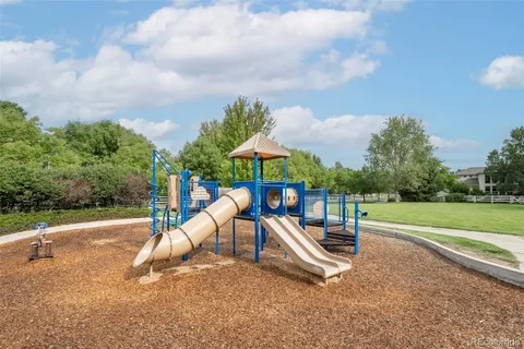 an aerial view of a house with a yard lake view and mountain view